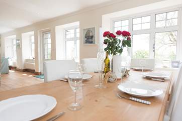 A large farmhouse table, perfect for a meal with friends and family.