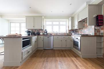 The gorgeous kitchen-area, equipped with a slow cooker, Tefal Optigrill, an Actifry and espresso machine.