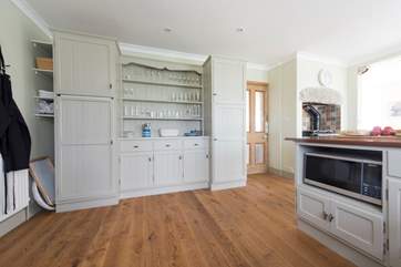 The spacious kitchen is lovely and simplistic.