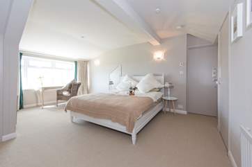 The first floor master bedroom with a top quality feather mattress and bedding.