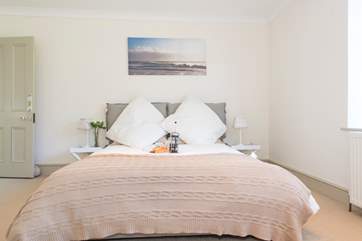 The ground floor double bedroom has a top quality five-foot mattress feather duvets, pillows and luxury bed linens.