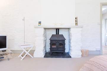 The bedroom has a wood-burner effect gas stove, as does the living-area.