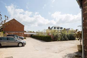 The Owner lives in the large house, with The Vineyard Retreat being left in the shot.