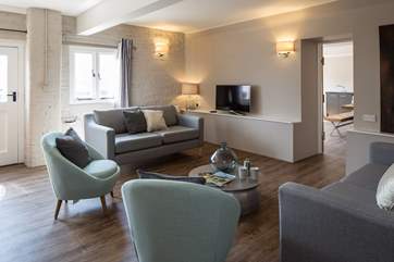Light and airy lounge area with a Smart TV.
