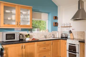 The kitchen-area is well-equipped for a couple.