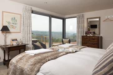 This super-king sized bed can also be made up as twins if you prefer. It opens onto the deck with fabulous valley views.