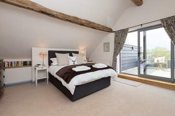 This is the first floor bedroom - with its fantastic private balcony and views for miles - quite literally.