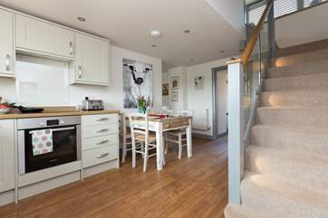 The modern kitchen/dining-room leads from the entrance hall.