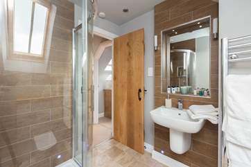 The very modern en suite shower-room, with large heated towel rail for toasty snug towels.