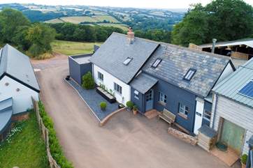 This stunning setting includes a wildlife lake, a shepherd's Hut with deck for guests to sit on/in to celebrate the views and acres of ancient woodland leading down to the River Exe to explore.