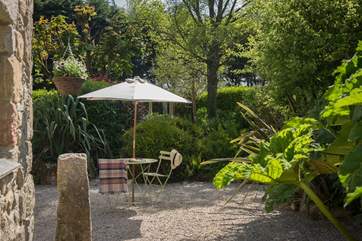 The enclosed courtyard garden is private due to the tropical planting.