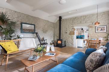 Sit a while on the rocking chair in front of the cosy wood-burner.