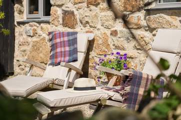 Comfy relaxing chairs, perfectly placed to enjoy the peaceful surroundings.