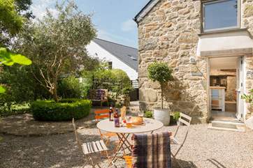 The space around the cottage is perfect for dining, a pre-dinner drink or sitting under a shady tree with a good book.