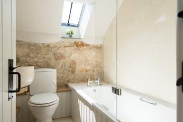 The bathroom sits between the two bedrooms.