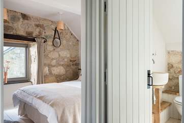 The double bedroom is at the front of the cottage with the bathroom next door.