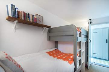 This bedroom is opposite the bathroom.
