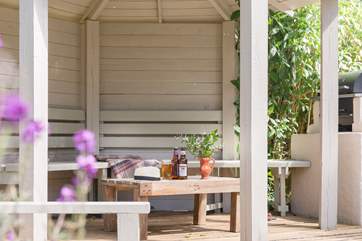 Sit under the garden gazebo with friends and family.