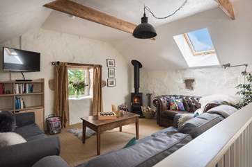 An eclectic combination of antique and modern furniture and carefully selected pictures and pieces make this a comfortable and very stylish home from home.