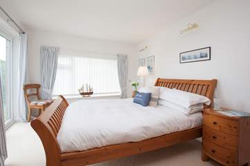 This gorgeous downstairs double bedroom has doors out the garden, a great bonus for those sunny days