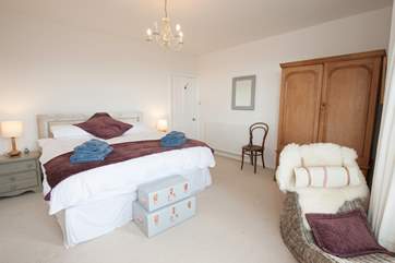 The spectacular master bedroom has a chaise longue to enjoy the lovely sea views,