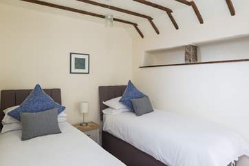 Second bedroom made up as twin beds.