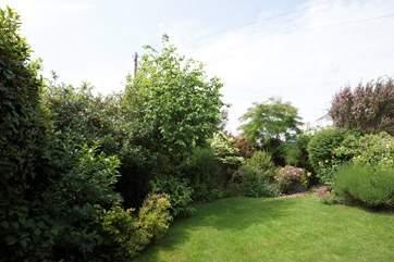 There is an enclosed lawn area to the rear of the house, perfect for children to play in the sunshine.