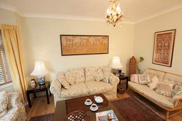 Sit down, feet up and relax in the quiet cosy sitting-room overlooking the Green.
