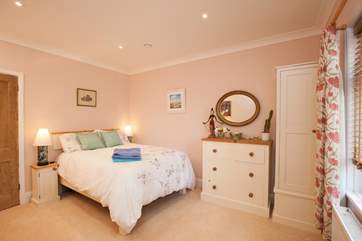 The second bedroom on the ground floor benefits from a generous king-size bed for a good nights sleep.