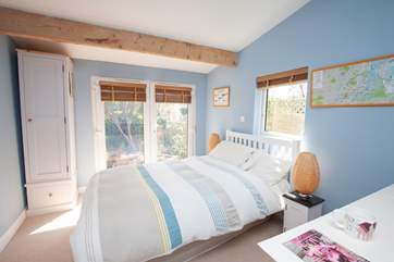 The double bedroom on the ground floor, overlooking the garden benefits from an en suite shower-room