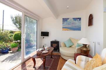 Just a few steps down from the kitchen takes you to this lovely snug area overlooking the garden.