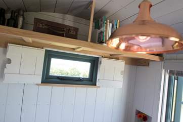 This cute window is revealed when the table is converted into a bed.