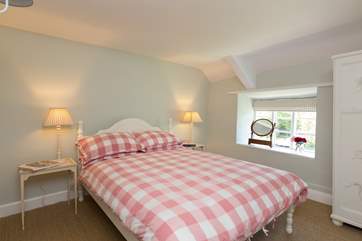 The cottage has been painted in gentle colours to suit its period style.