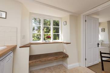 Pretty cottage windows make the most of this peaceful setting.