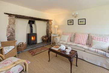 The sitting-room has a wood-burning stove making this a great place to stay all year round.