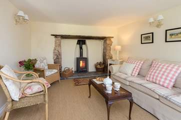 This photograph gives you an idea of the size of the sitting-room.( There is an extra armchair not shown in the photo.)