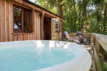 Soak in the hot tub or relax on the loungers taking in the view from the spacious deck.