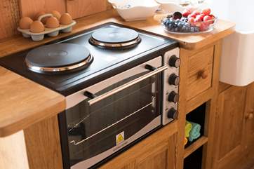 A mini cooker with hob is provied as your cooking appliance.
