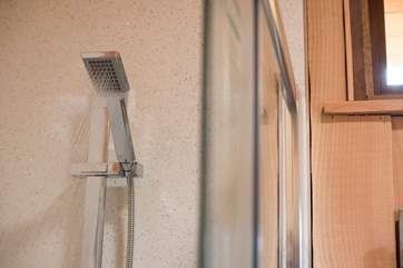 There is a large walk-in shower cubicle.