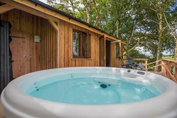 Complete with a bubbling hot tub to enjoy those views too.