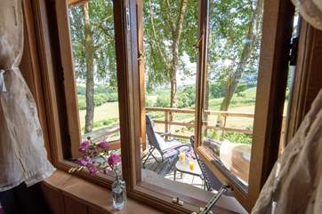Looking out the window at the end of the bed, across the deck and beyond.