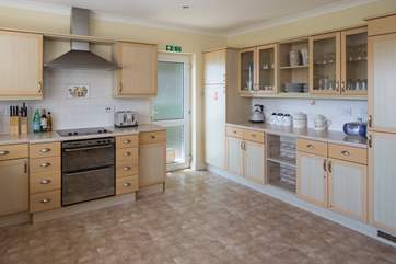 Spacious and well-equipped kitchen, which leads out onto the decked area.
