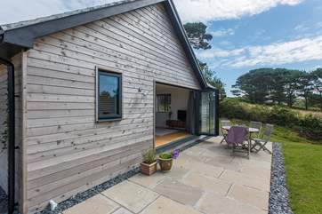 Bi-fold doors lead to the terrace.