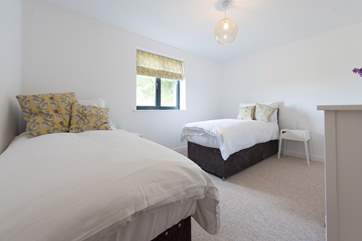 The twin bedroom also has an en suite shower-room.