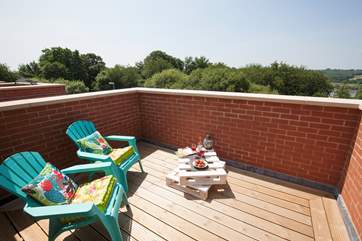 The stunning roof terrace is the perfect reatreat to relax and have a glass of wine once the children have gone to bed