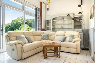 The comfy sitting-room with sliding doors leading out to the terrace.