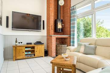 There's a second wood-burner in the sitting-room and the mother of all TVs!