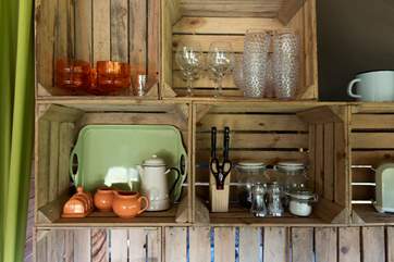 The quirky kitchen shelves have been creating using apple crates.