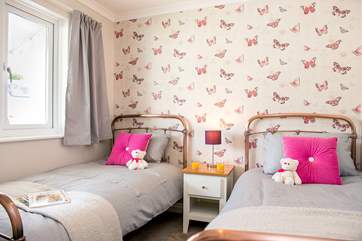 Bedroom 4 has delightful copper-effect bedsteads.