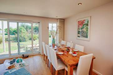 Seating 8, this fabulous dining room table overlooks the river, a beautiful setting for a family meal